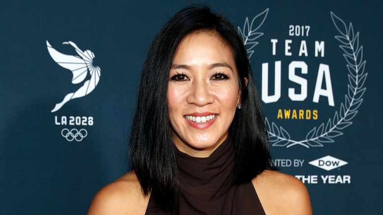 Michelle Kwan smiling on step-and-repeat in 2017