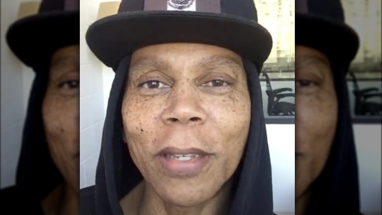 RuPaul smiles makeup free