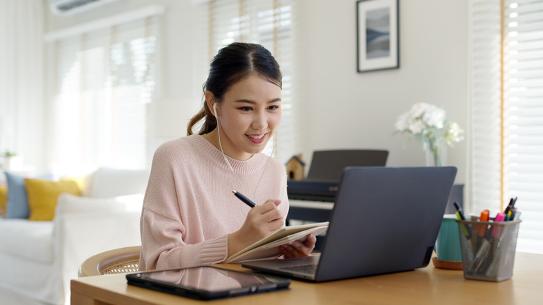 woman working at a desk in her home