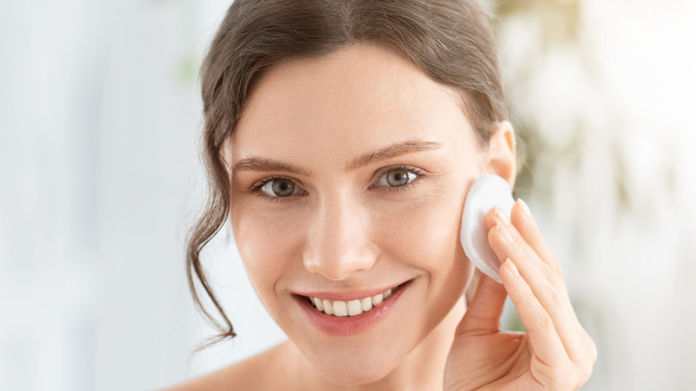 Woman using toner