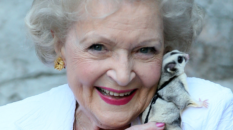 Betty White holding a small animal