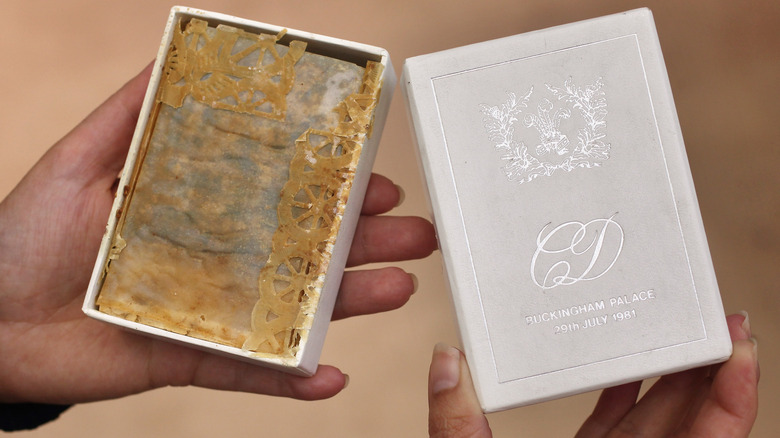 Old slice of cake in box from King Charles III and Princess Diana's wedding