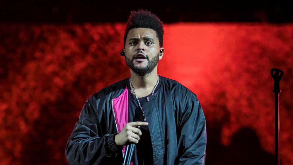 The Weeknd, performing on stage.