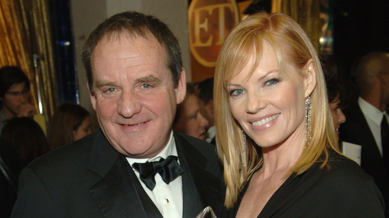 Paul Guilfoyle and Marg Helgenberger posing together at an award show