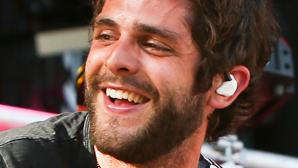 Thomas Rhett performing on stage