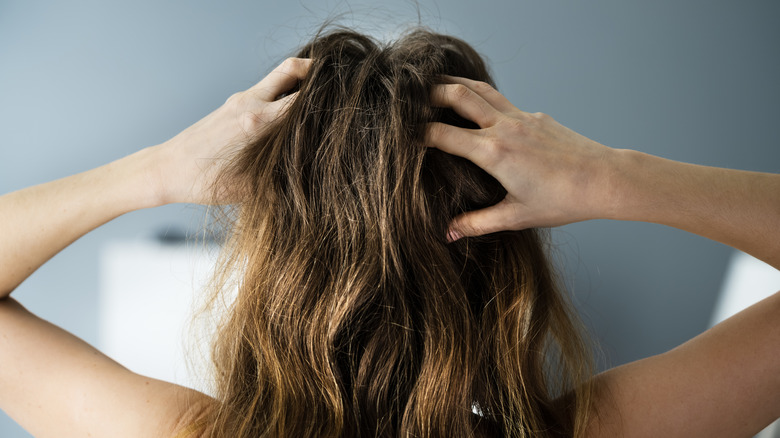 Woman with itchy scalp