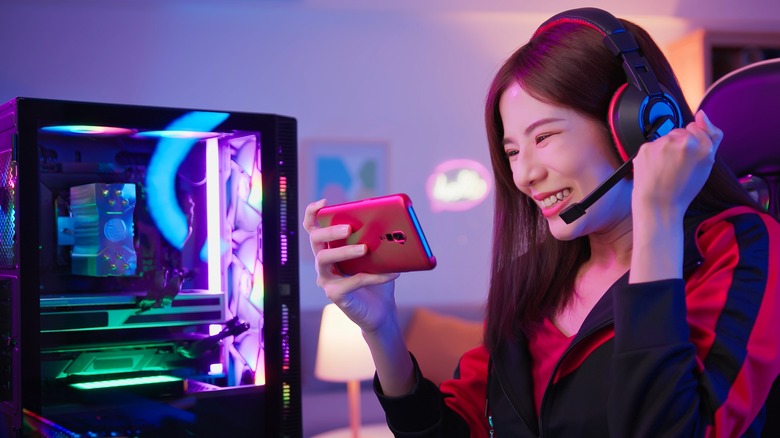 A gamer looking at her phone