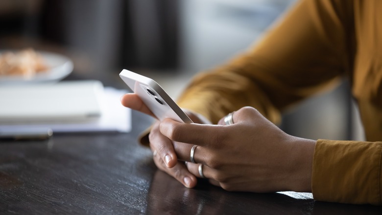 woman texting on phone