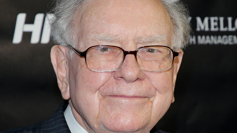 Philanthropist Warren Buffett grinning in glasses