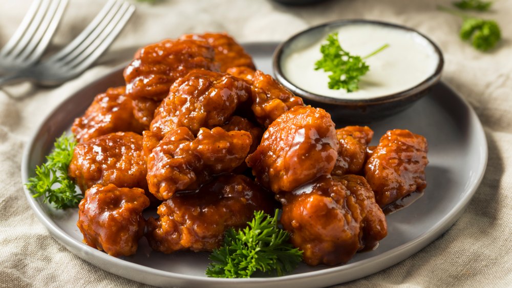 Plate of boneless wings with sauce