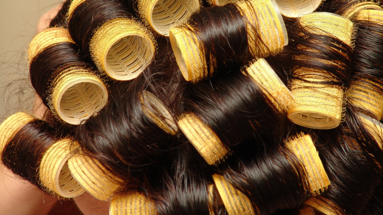 yellow velcro rollers in hair 