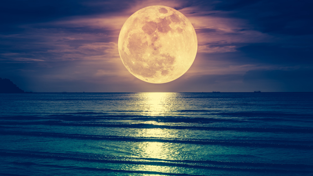 Full moon over the ocean.