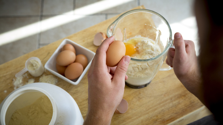 Man making pre-workout protein shake