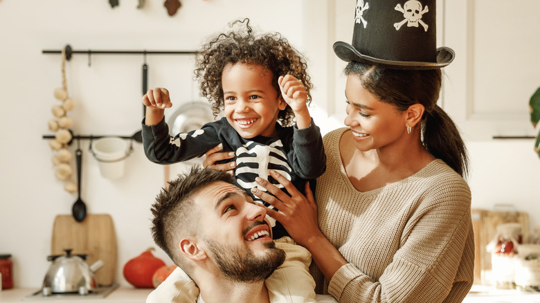 Family playing together in cosumes