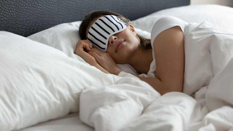 Woman sleeping with eye mask