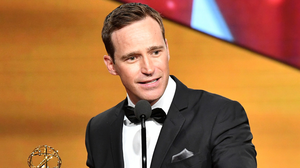 Mike Richards in tux accepting an Emmy