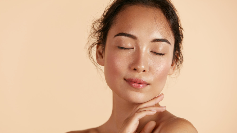 Fresh-faced woman with closed eyes