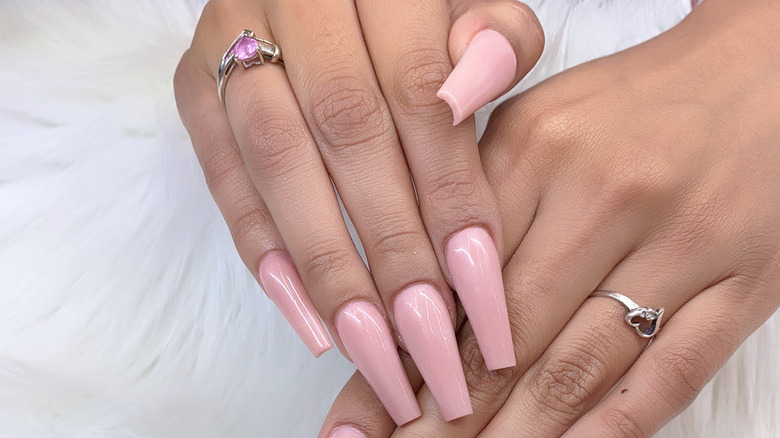Woman with pink coffin nails