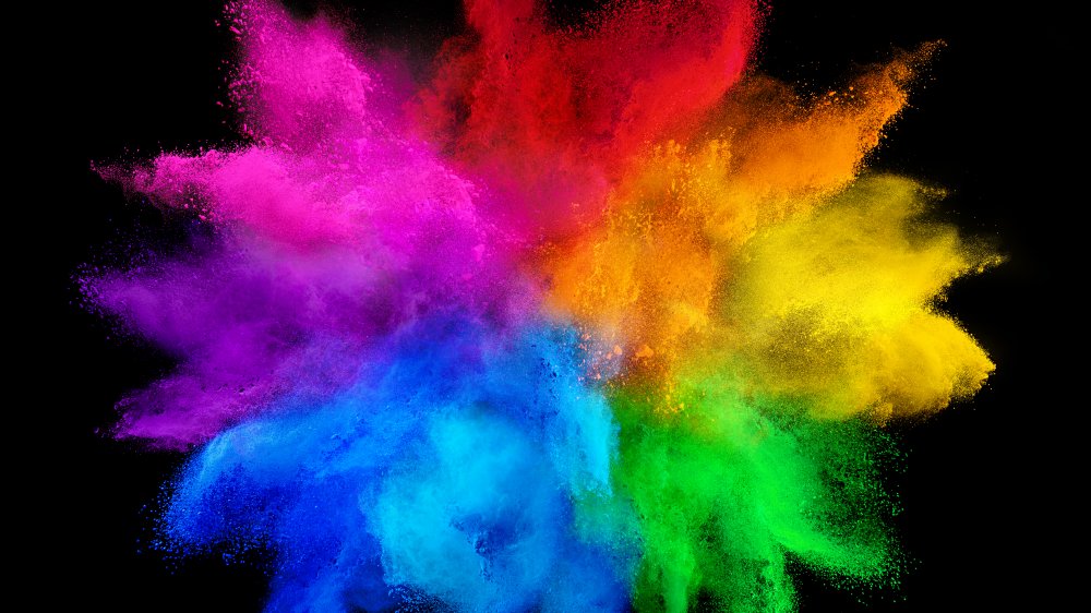 Rainbow of color in front of black background 