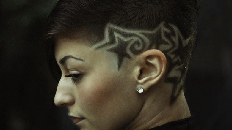 Patterns shaved into a woman's undercut