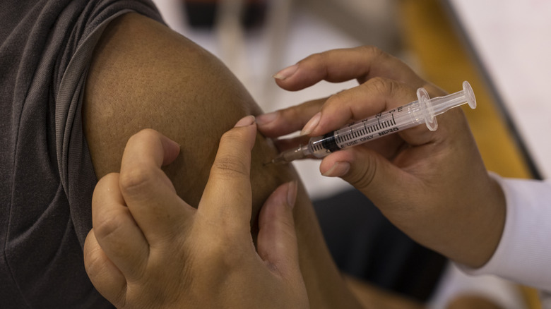 person getting vaccine