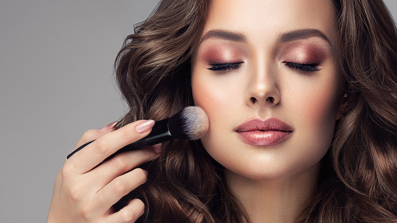 Woman getting her makeup done