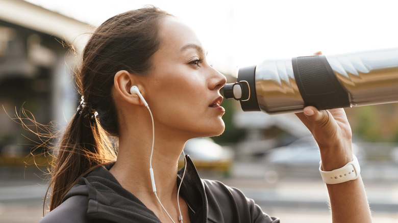 Woman drinking water from bottle