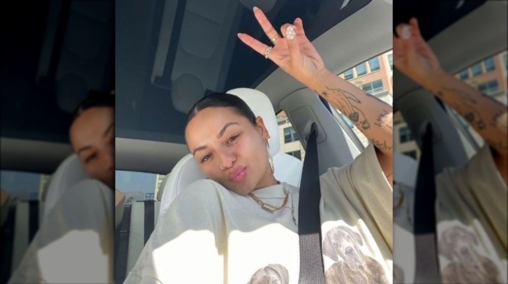 Sammie Cimarelli posing in a car