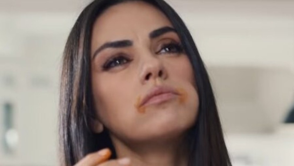 Mila Kunis eating Cheetos in commercial