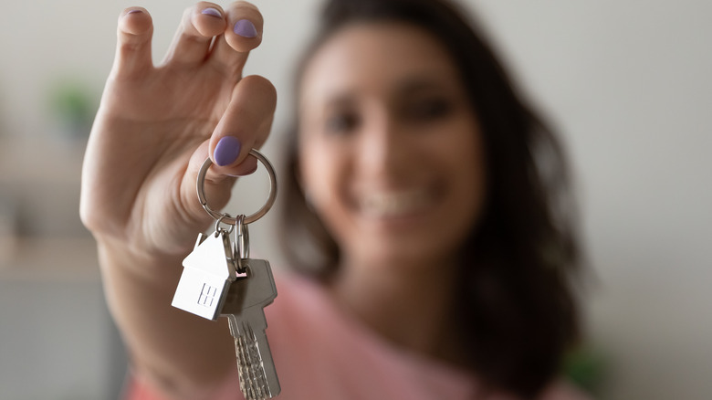 Woman holding out keychain