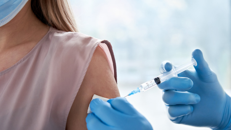 Woman getting COVID vaccine