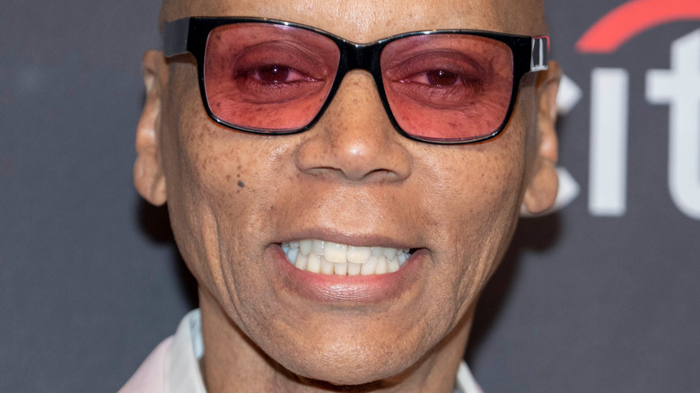 RuPaul Charles smiling on the red carpet