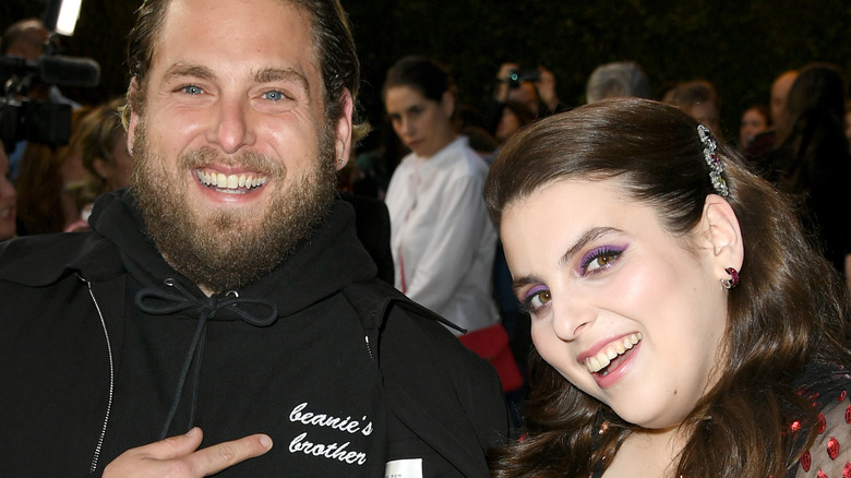 Jonah Hill and Beanie Feldstein pose at an event together