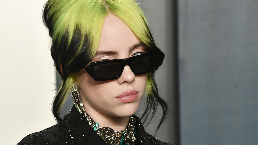 Billie Eilish with green roots 