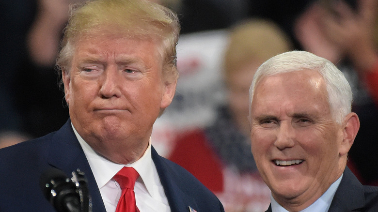 Donald Trump and Mike Pence standing at the podium