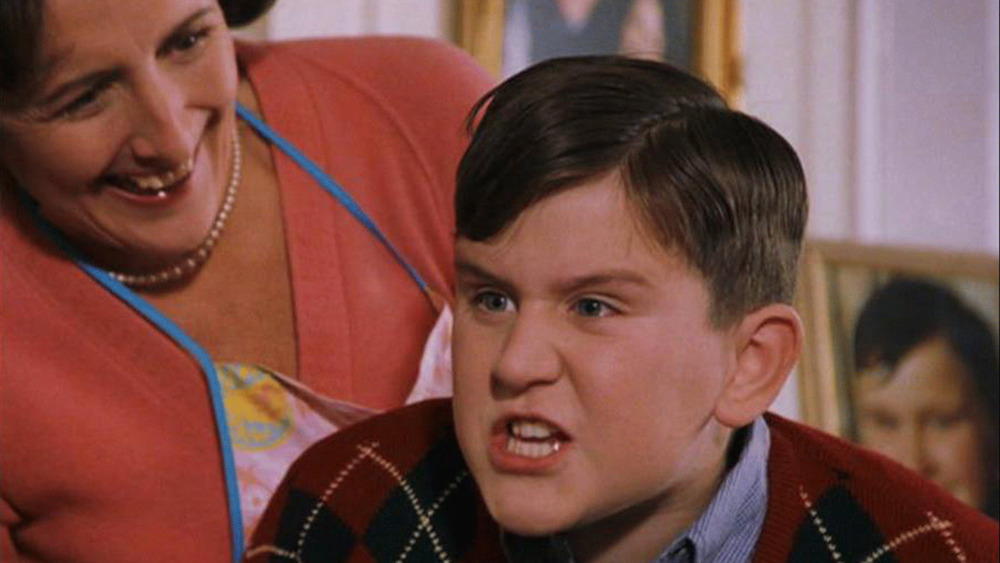 Harry Melling sneers as Dudley Dursley in Harry Potter