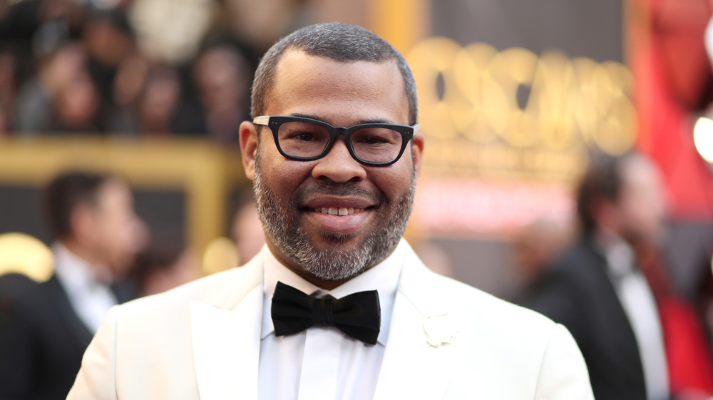 Jordan Peele in tux on the red carpet