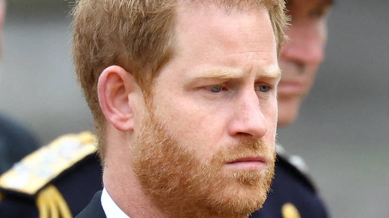 Prince Harry frowning