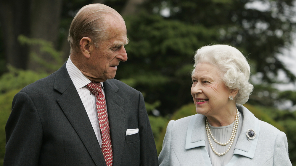 Prince Philip and Queen Elizabeth looking at each other