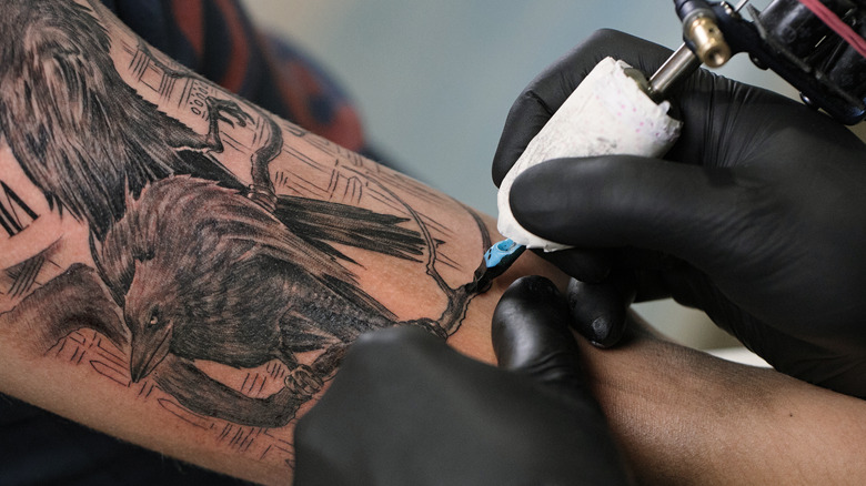 Arm being tattooed 