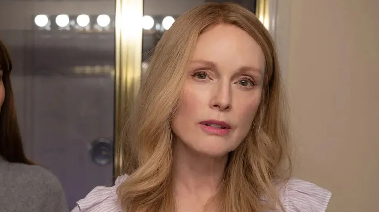Julianne Moore and Natalie Portman looking in a mirror in May December