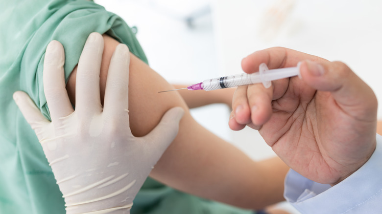 Person receiving a vaccine