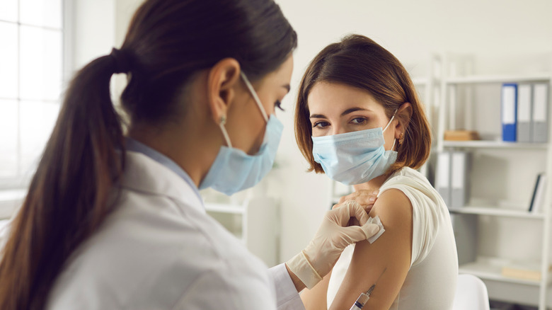 Woman receiving a vaccine