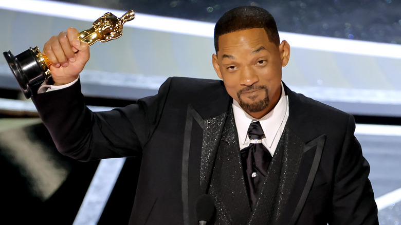 Will Smith smiling, holding Oscar award