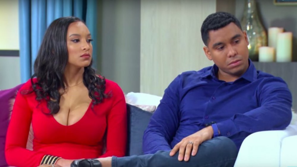 90 Day Fiance stars Chantel and Pedro sitting on a couch, looking serious