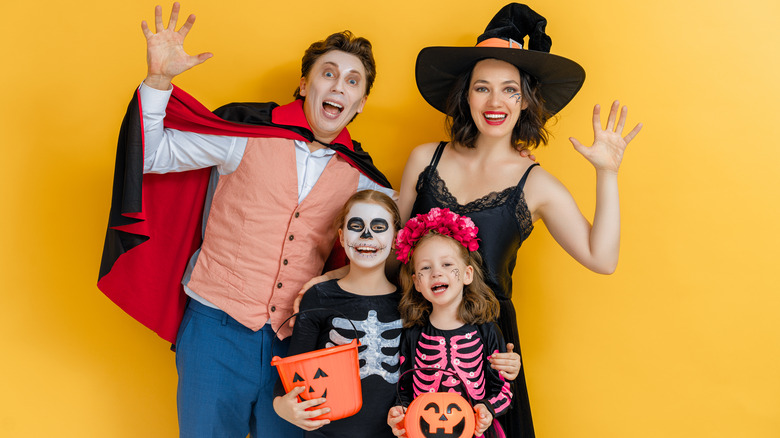 Family in Halloween costumes