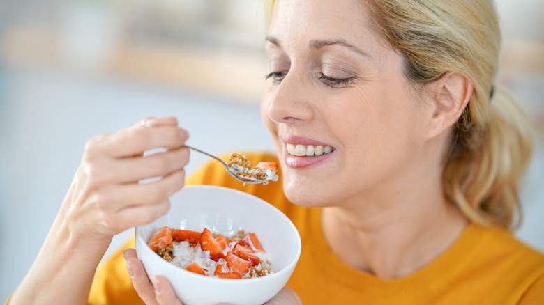 Woman eating cereal