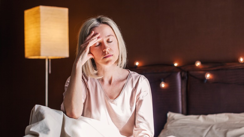 woman stressed in bed 