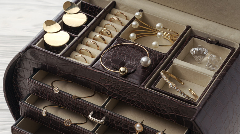 A jewelry box full of various jewelry pieces