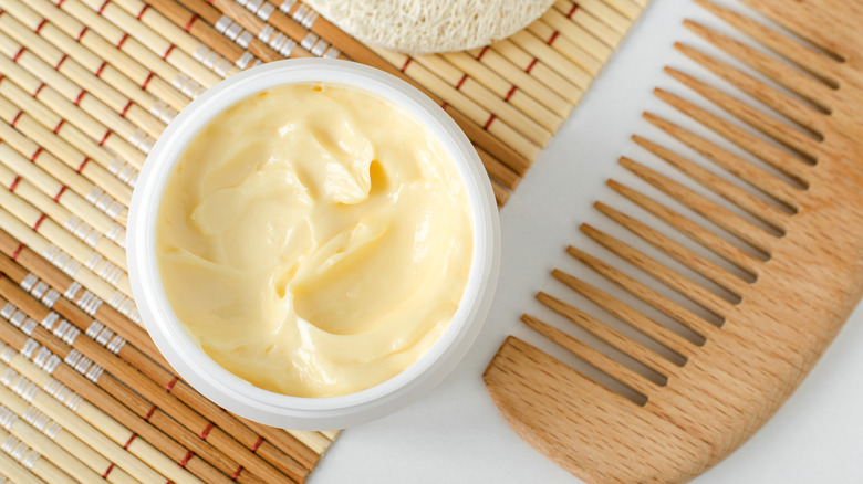 Mango butter with wooden comb